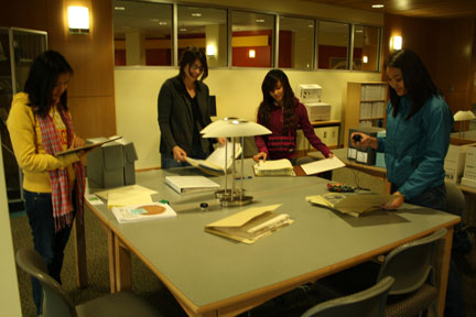 students looking at archival materials.
