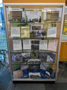 A display case filled with materials from the Alaska Federal Lands Project